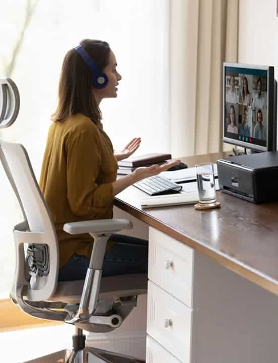 woman collaborating remotely with team via cloud services