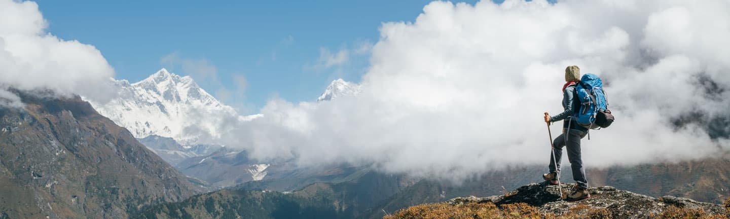 person-on-mountain-top-with-clouds