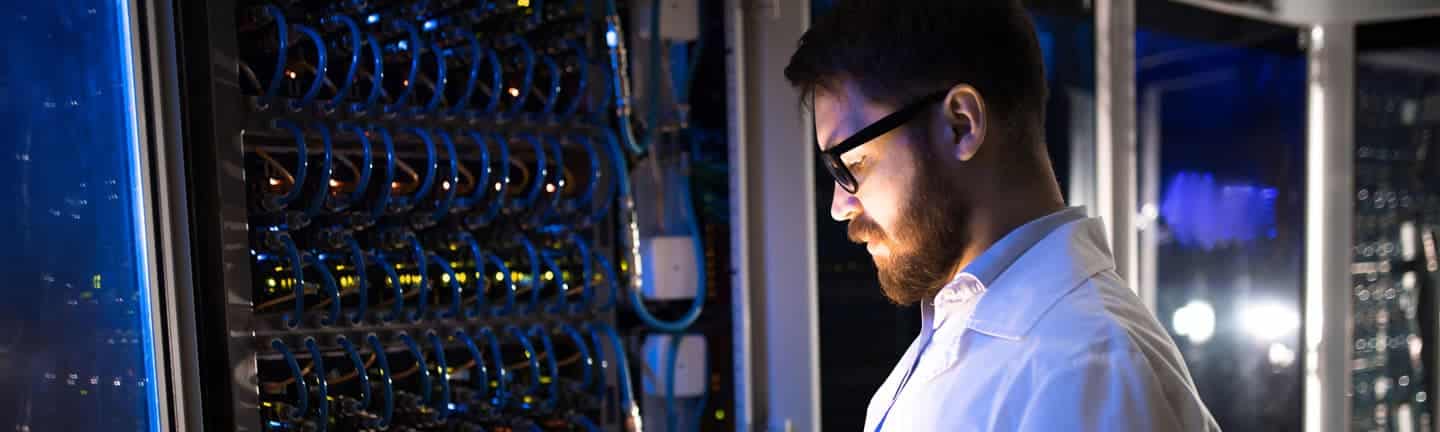 man standing by hyperconverged items in data center