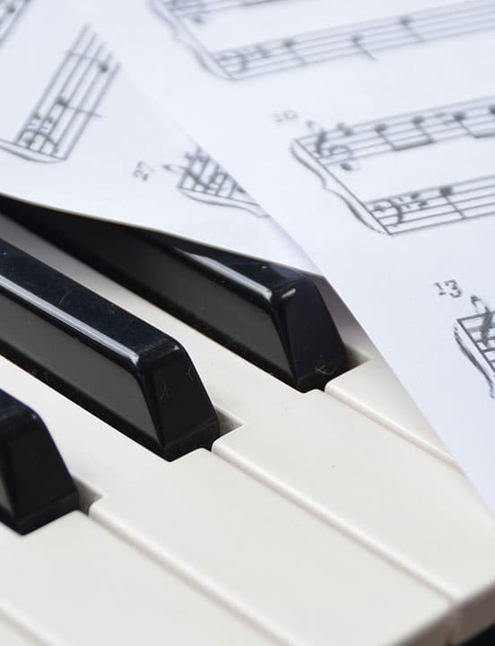 piano keys and musicnotes sheet music
