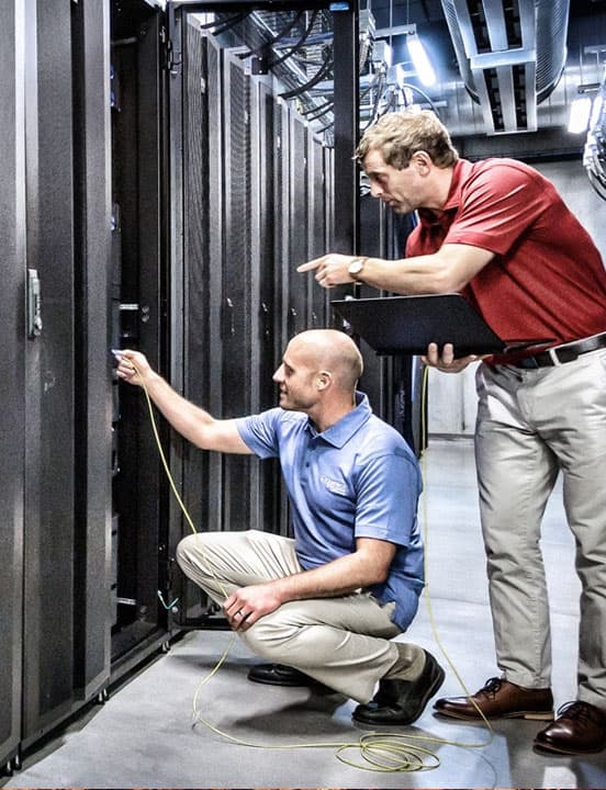 data center workers checking out cabinet network