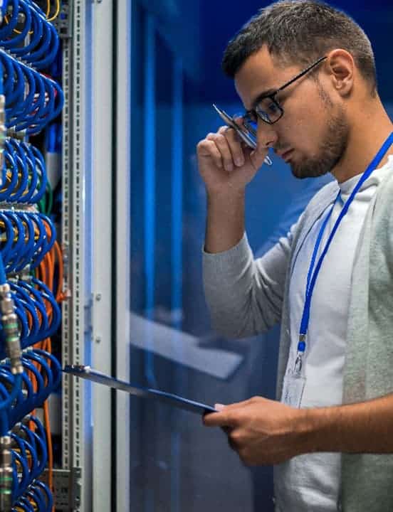 Data center worker performing a storage assessment