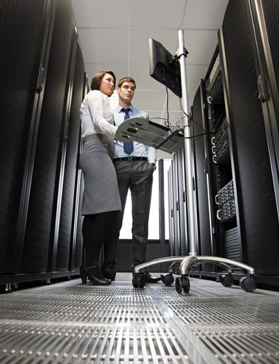 data center workers monitoring system infrastructure