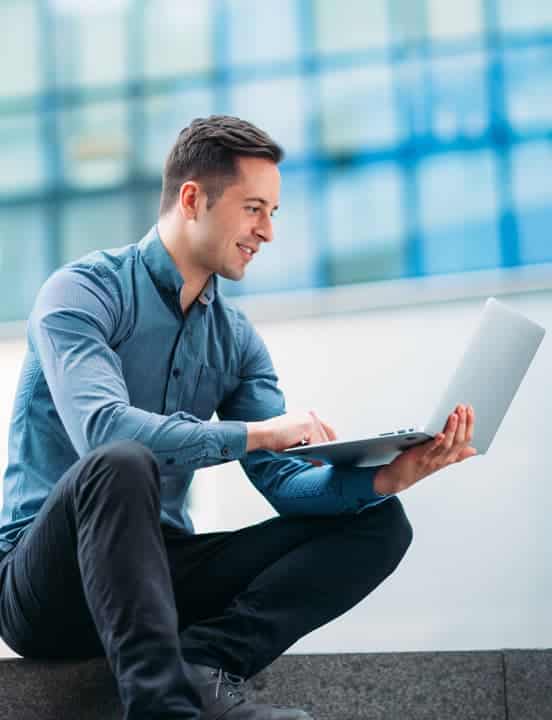 man working remotely with virtual desktops