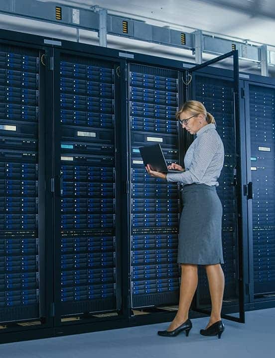women at cabinet in data center