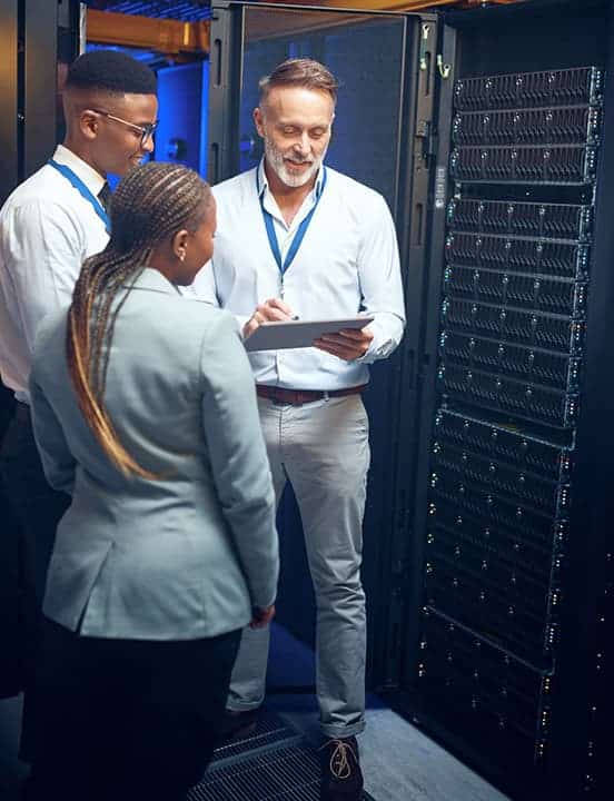 group hovered near server rack in data center
