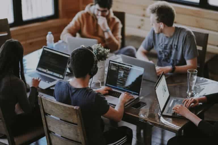 people working at table together