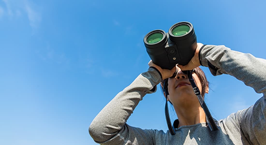 person using binoculars