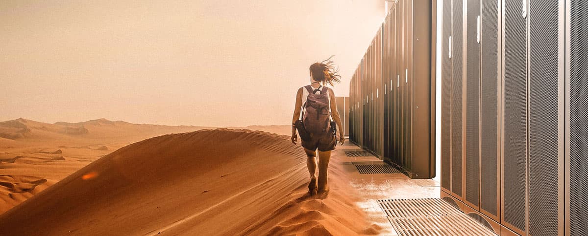 woman in desert with server racks