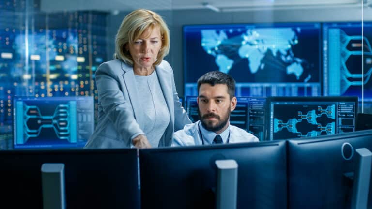 Man and woman in a security operations center (SOC)