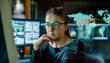 woman-looking-at-computer-with-reflection-in-glasses