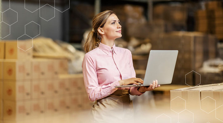 woman-in-factory-warehouse-with-computer