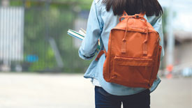 student-with-backpack-and-books